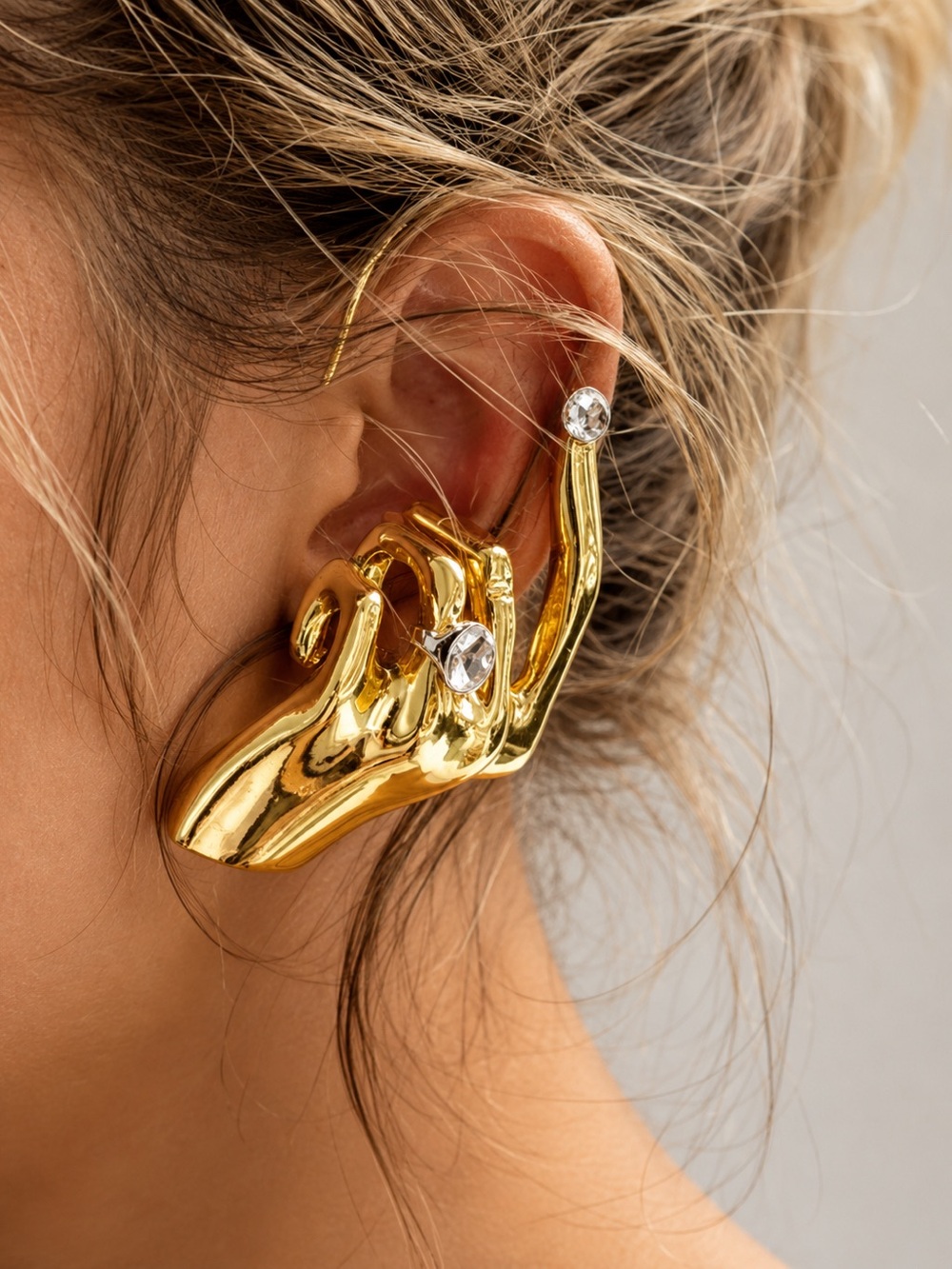 Anthropologie Gold Sculptural Hand Ear Cuff with Clear Stones